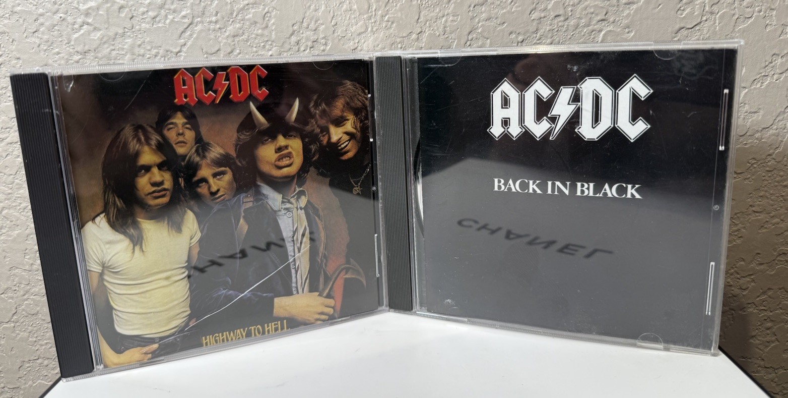 Lot of 2 – AC DV Highway to Hell & Back on Black (CD’s)