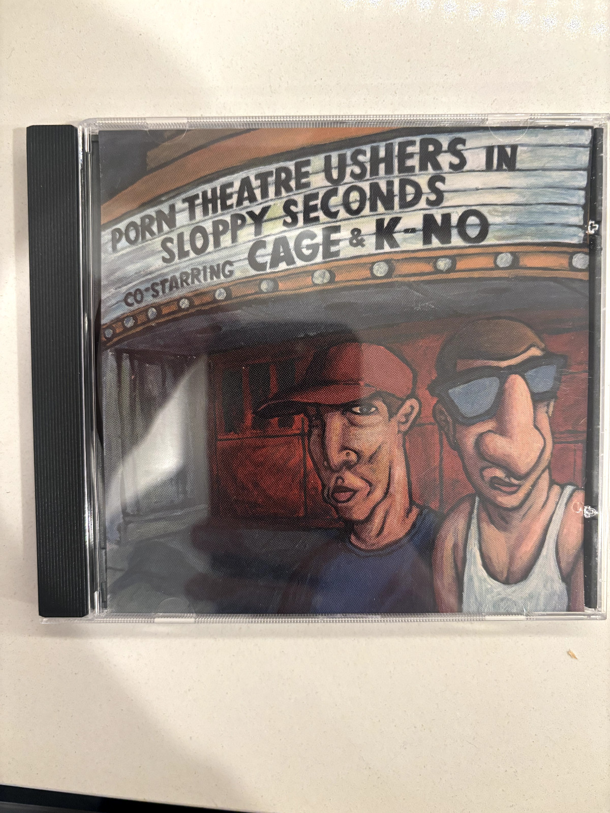 Porn Theatre Ushers – Sloppy Seconds CD, Cage & K-No
