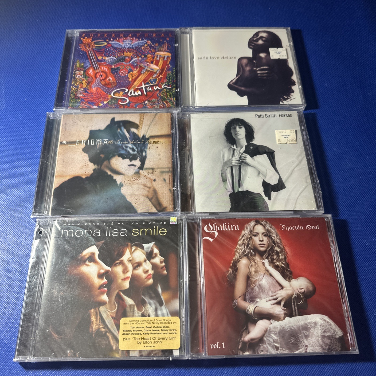 #A49 Lot of 6 mixed Sealed CDs Santana, Enigma, Shakira, Patti Smith, Etc